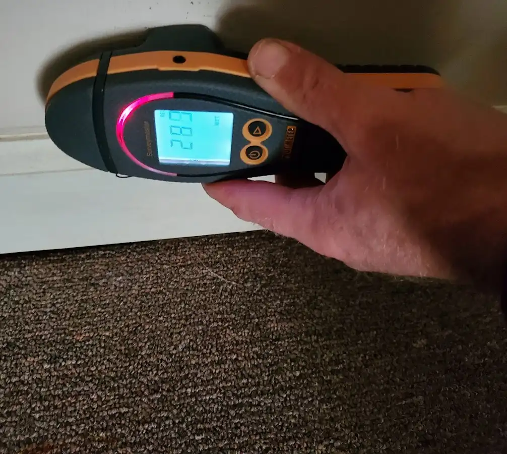 Moisture detection at baseboard during Storm Damage Restoration in Grove City